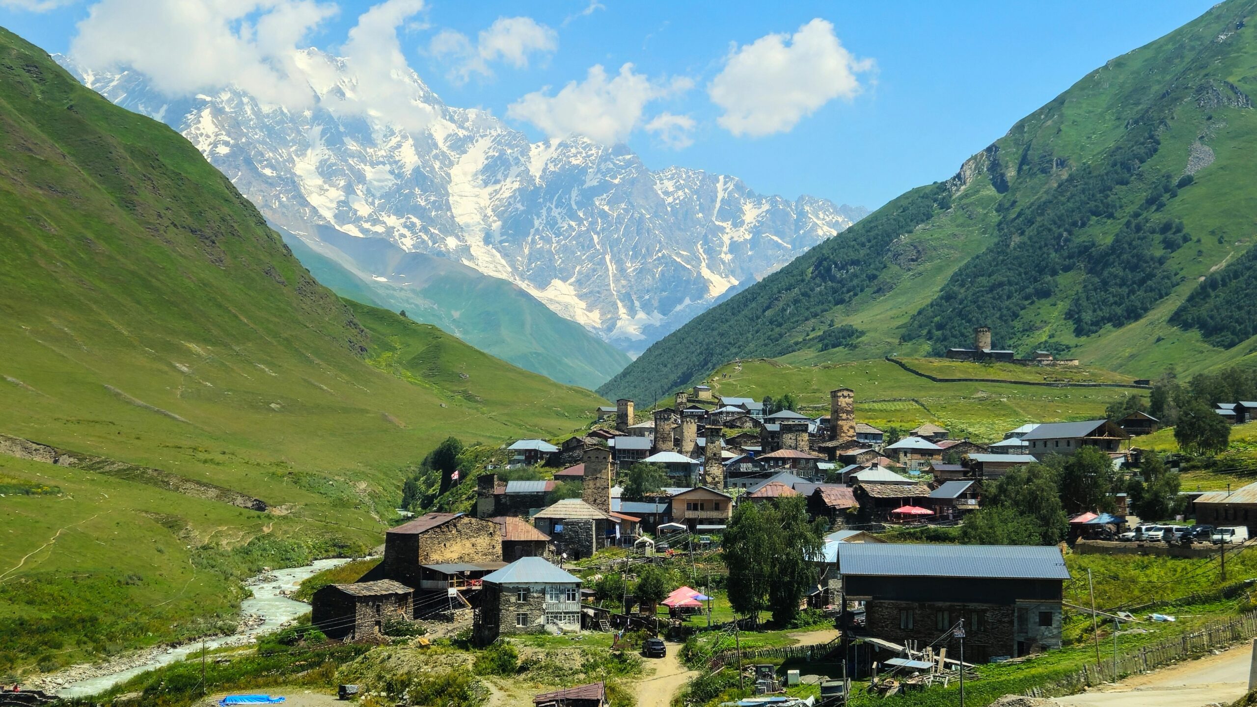 Scenic view of Ushguli village against the backdrop of the Caucasus Mountains in Georgia.